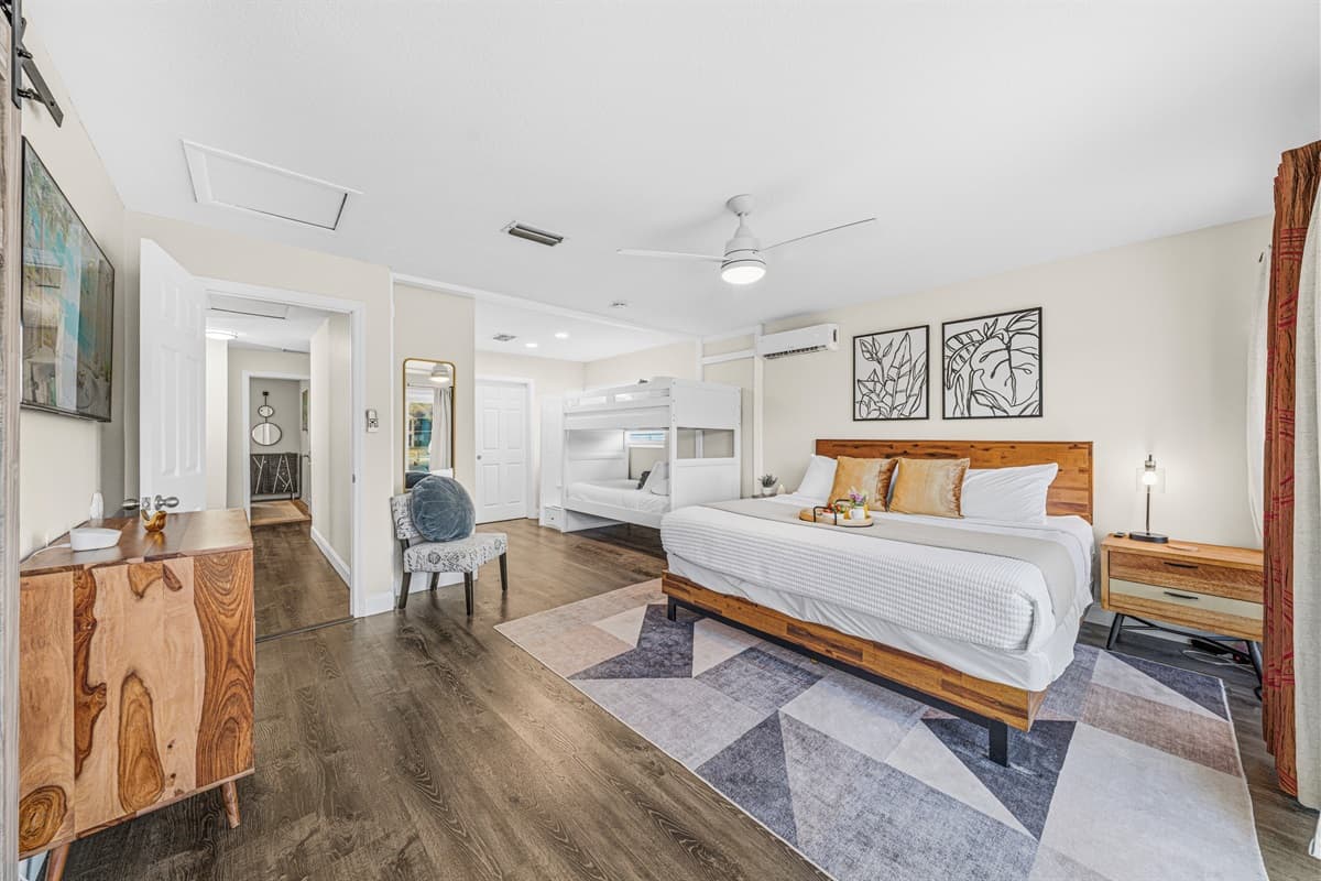 Bright and airy bedroom offering comfortable sleeping arrangements for families and groups.