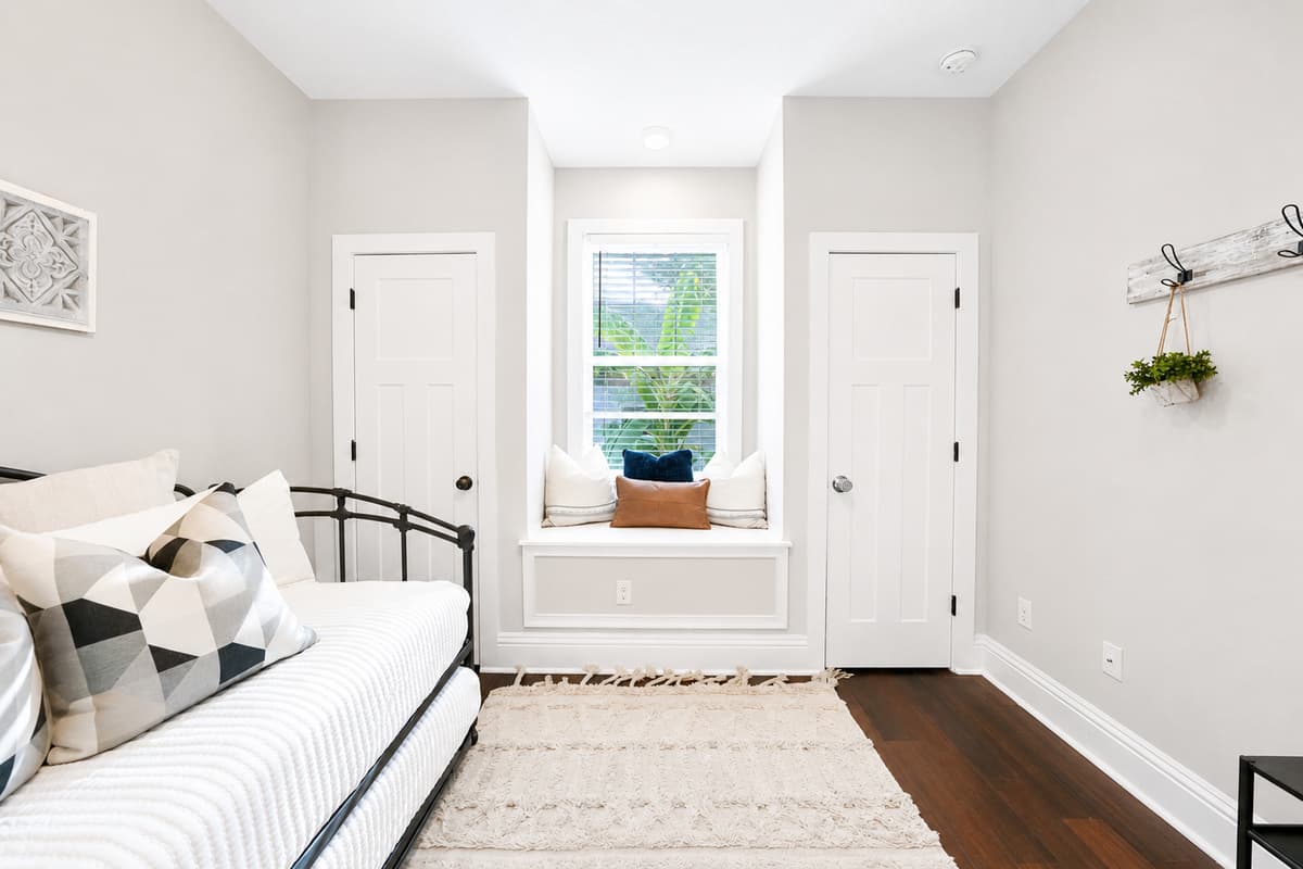 Enjoy a peaceful sitting area with a charming window seat and plenty of natural light.