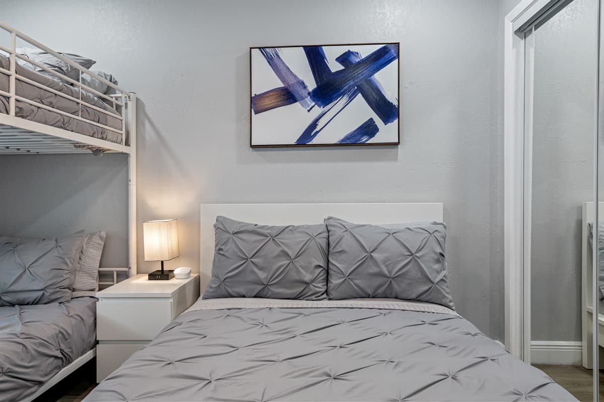 Our wonderful bedroom with a comfortable huge bed, a bunk bed and its own smart TV. Feel at home in your home away from home. If you think you'd enjoy your trip to this property, send us a message now!