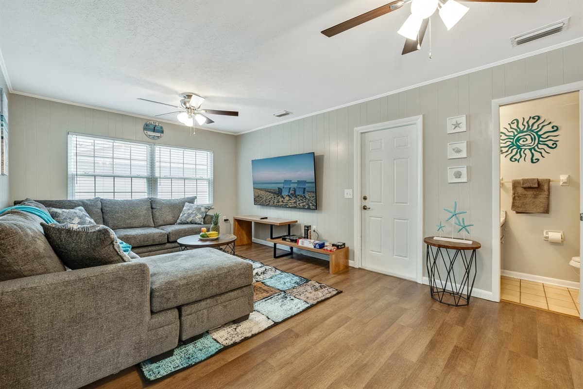 The ambiance is heightened by elegant wooden floors and complemented by a cutting-edge smart TV.