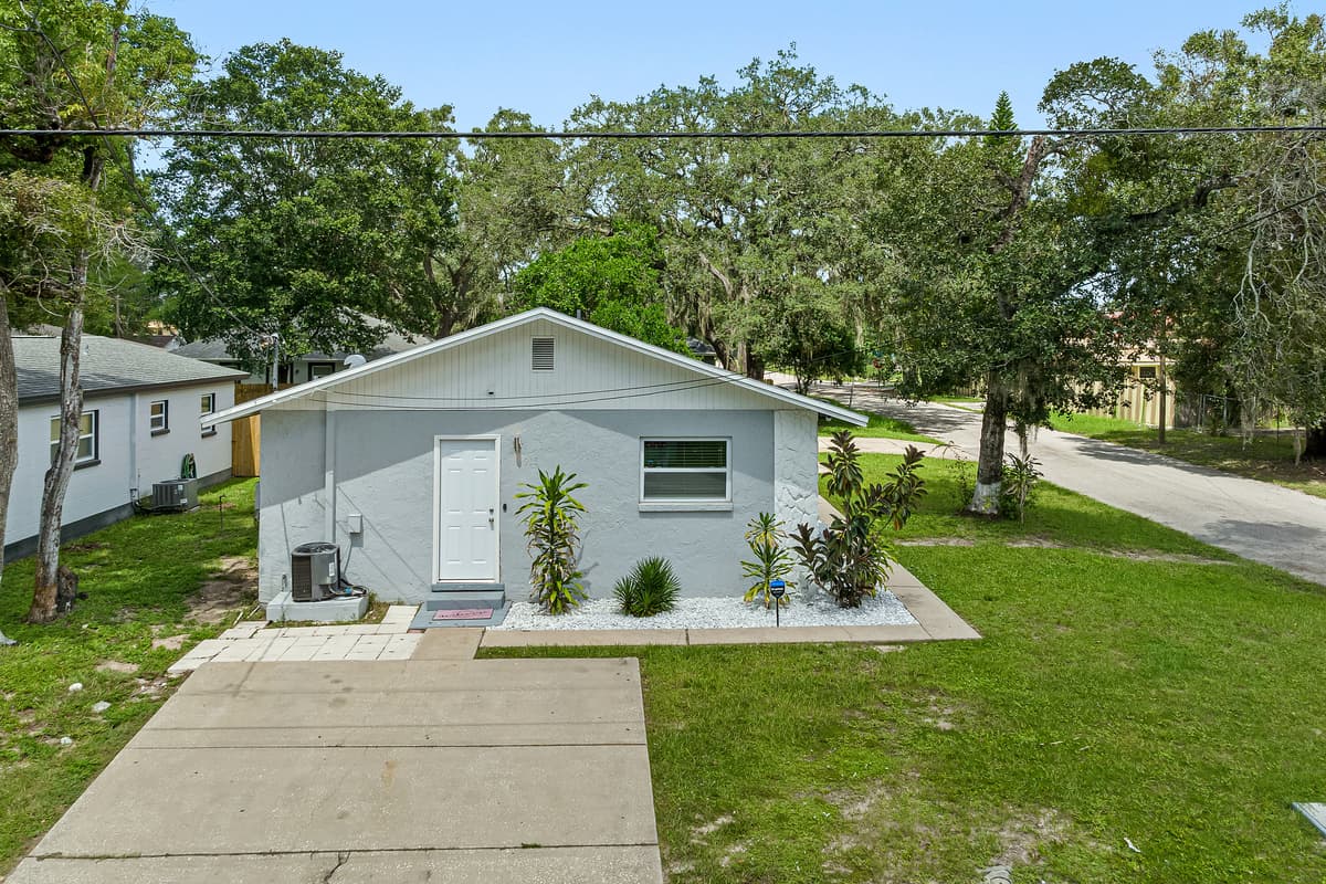 The immaculate front view of this property showcasing the front yard and parking area that is equipped with CCTV cameras to ensure your safety during your stay. If you are interested in this property, send us an inquiry now!