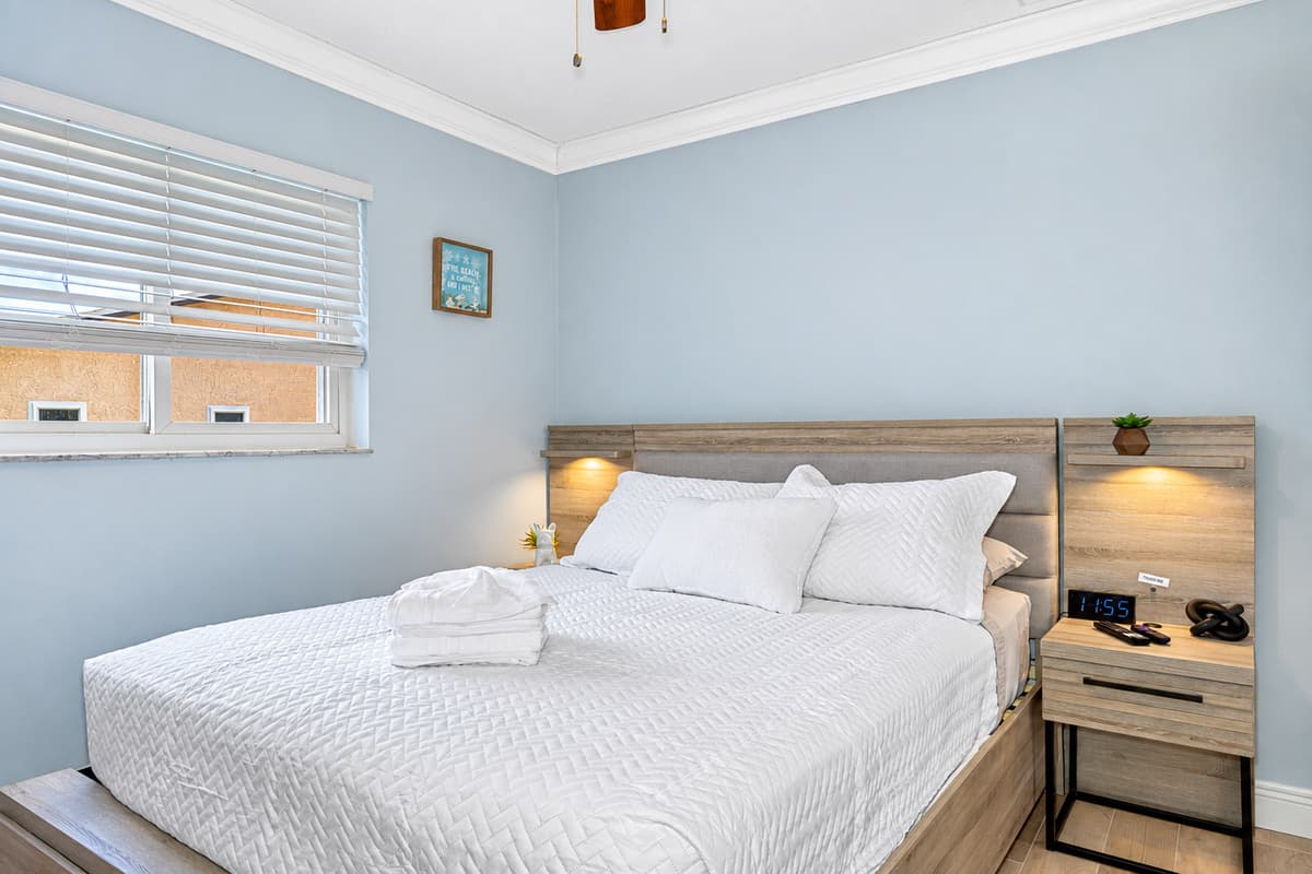 The bed's elegant design and soft textures create a warm and welcoming atmosphere, making it an ideal sanctuary for relaxation.