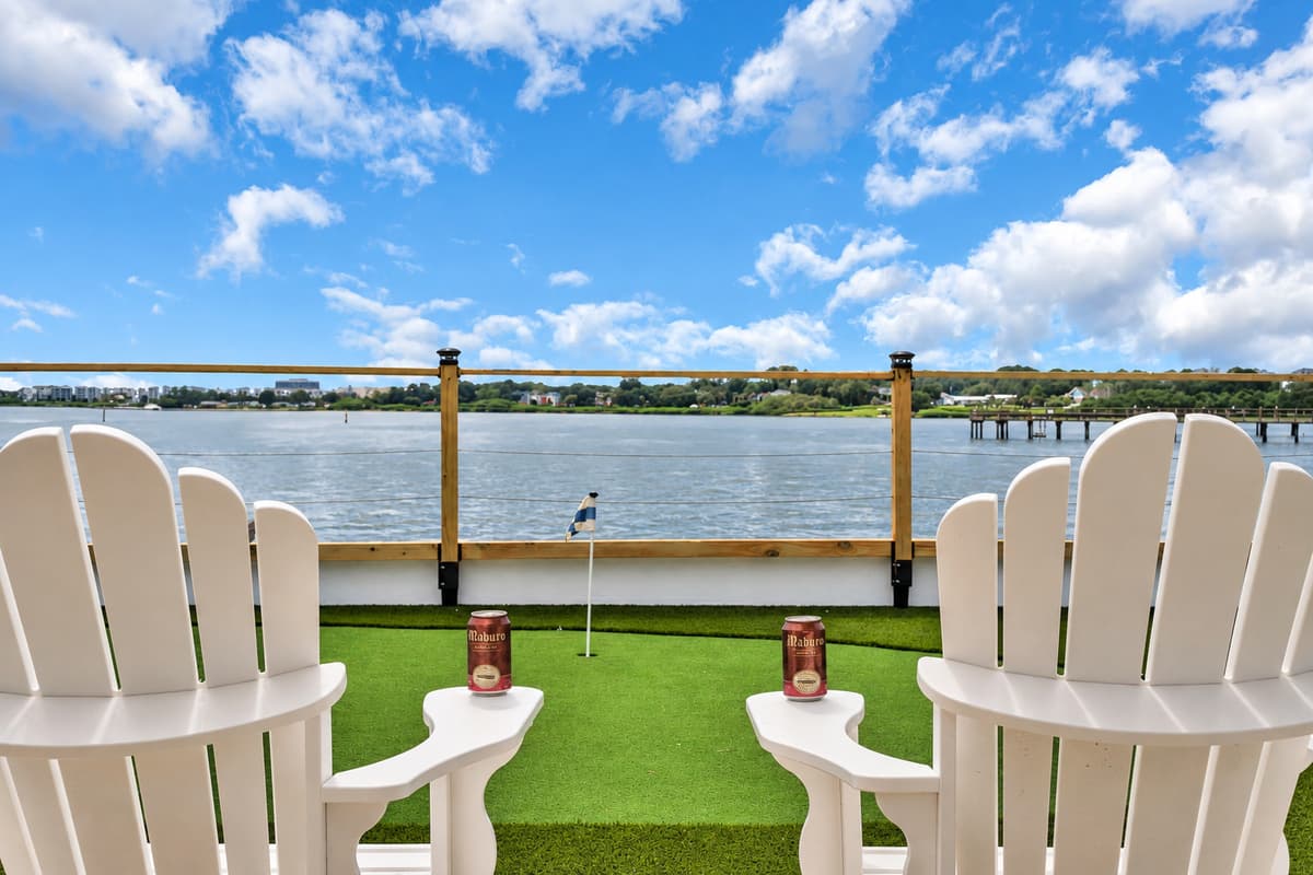 Two chairs, two drinks, one great view. Adirondack chairs face the putting green and the bay. Find your spot, crack a cold one and let the day wind down.