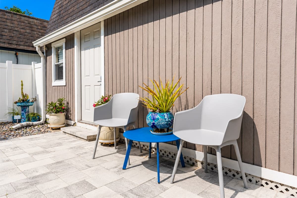 Cozy outdoor seating nook near the entrance — a perfect spot for morning coffee or evening relaxation.