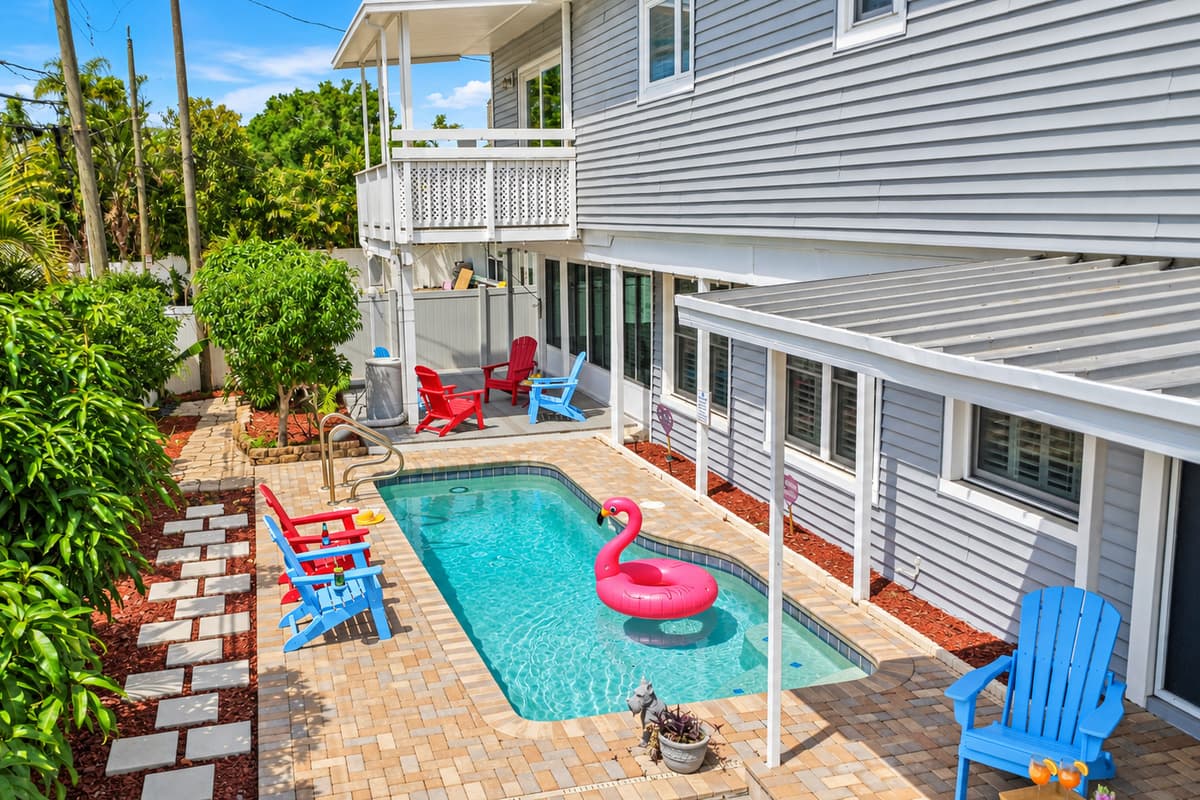 Backyard overview featuring the private pool, lush greenery, and surrounding patio space—your own secluded retreat 