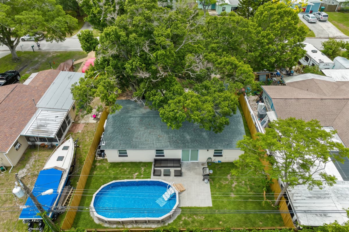 Aerial top view of our incredible house showcasing the beautiful swimming pool!