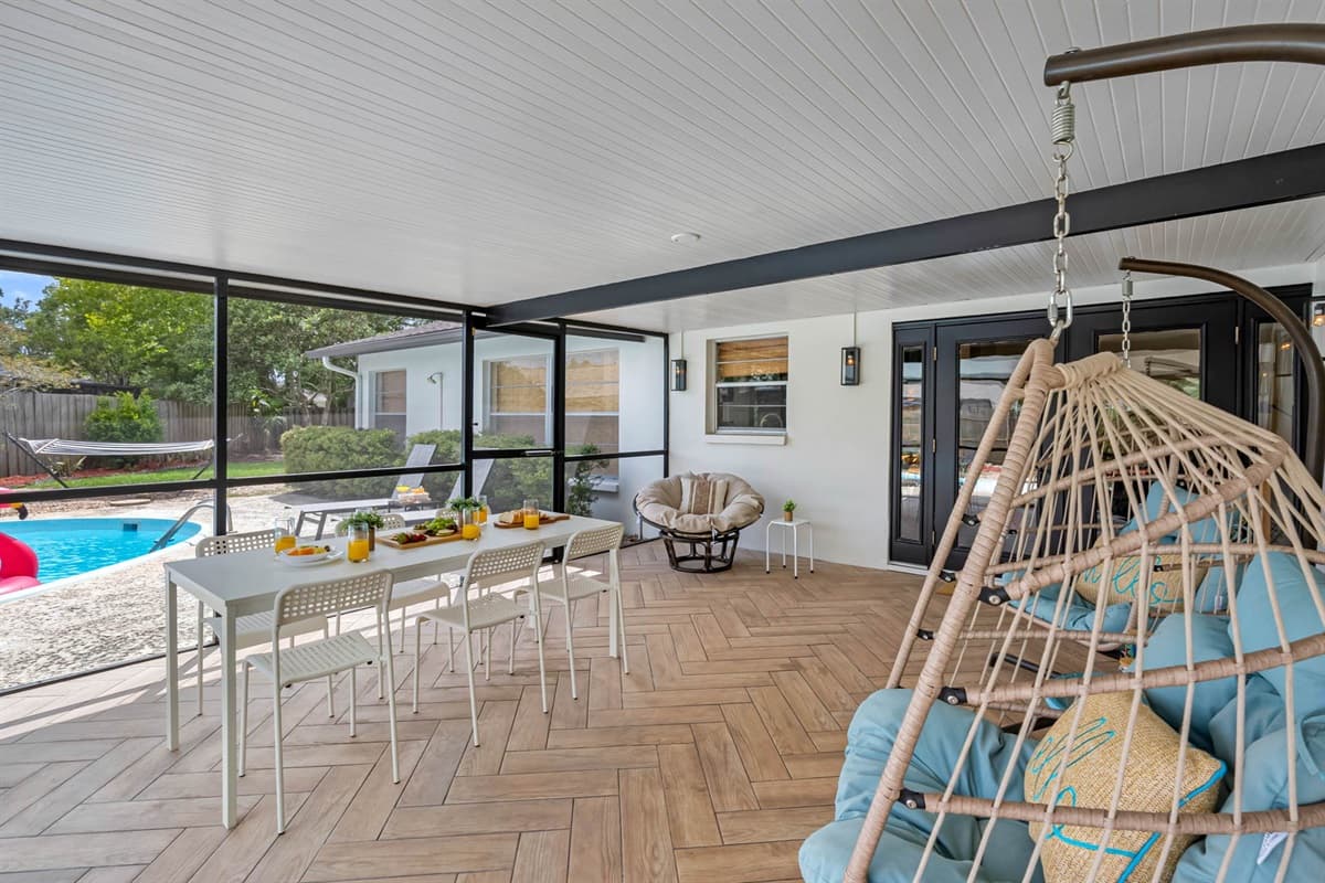 Whether you’re sipping morning coffee or lounging after a swim, the cozy textures and stylish furnishings create the perfect vibe.