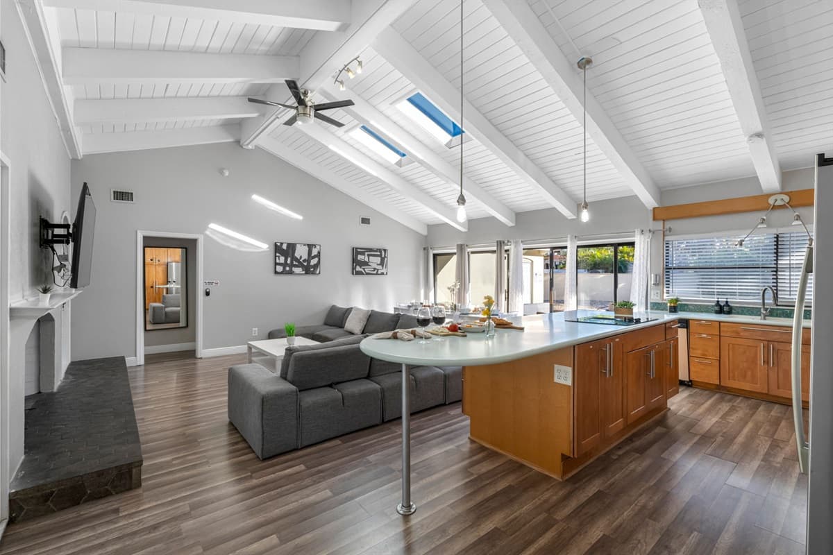 This open-concept kitchen features ample counter space and storage — ideal for families or groups.
