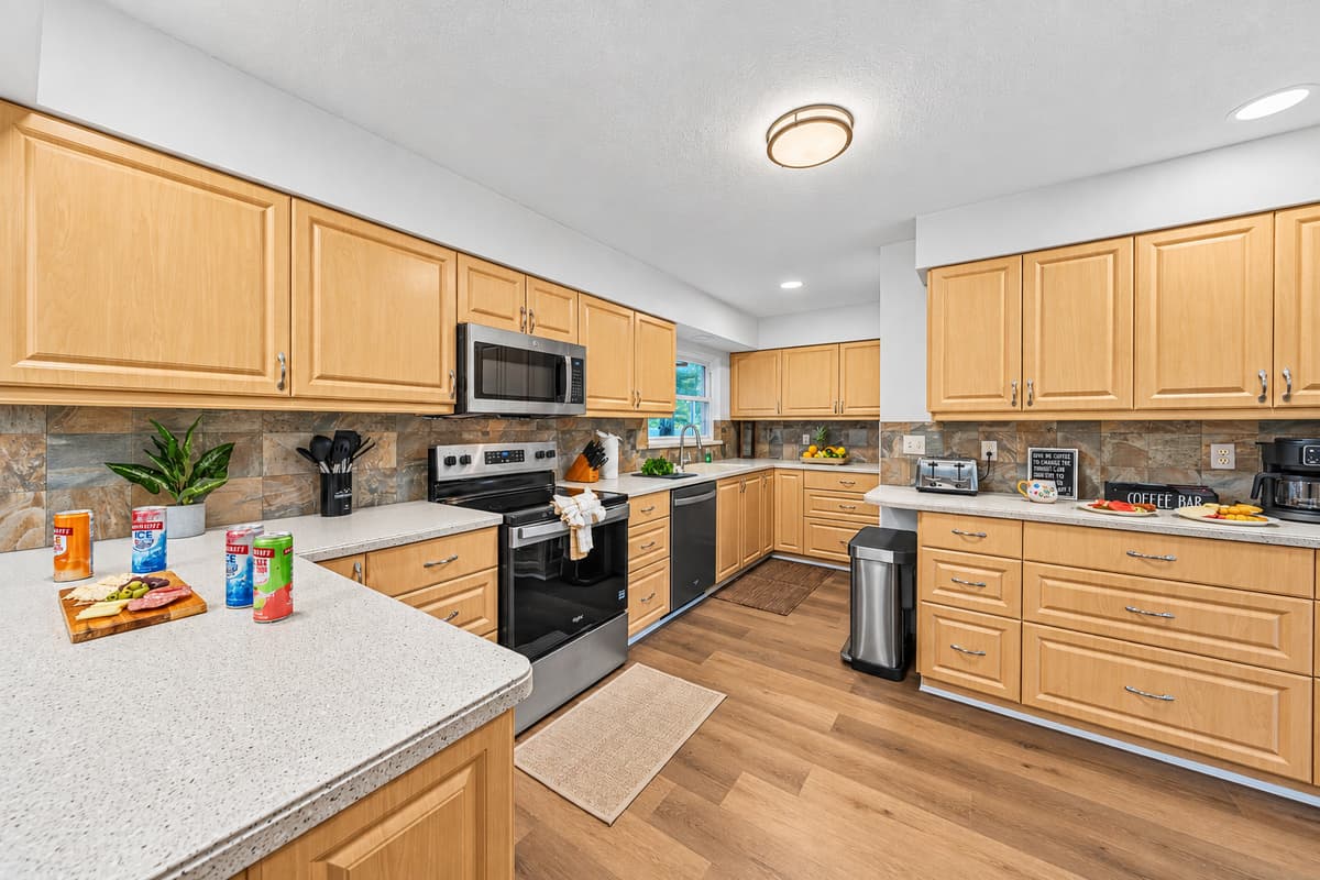 Fully equipped kitchen with modern appliances and an open layout for easy meal preparation 