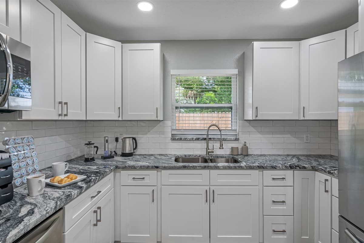 Our beautiful kitchen has a lot of storage so you don't have to worry about stuff in the kitchen getting cluttered. Have the best time with family and friends with great meal during your stay! Book this property now!