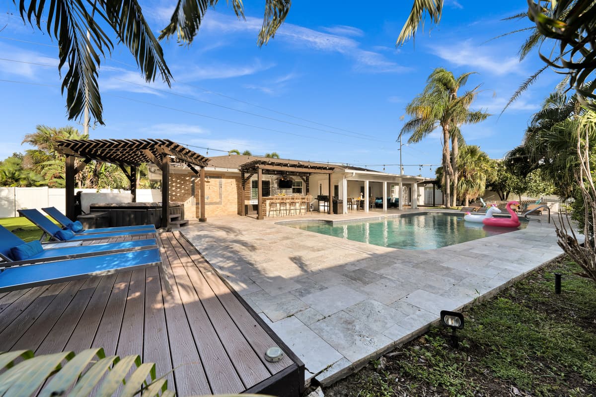 One sweeping view captures it all, private hot tub, sun deck, sparkling pool and outdoor bar, a backyard built for unforgettable group getaways