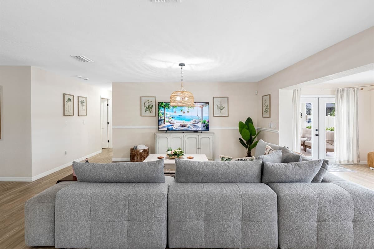 Kick back on the oversized sectional in this warm and welcoming living room. The big-screen TV sets the stage for movie marathons.