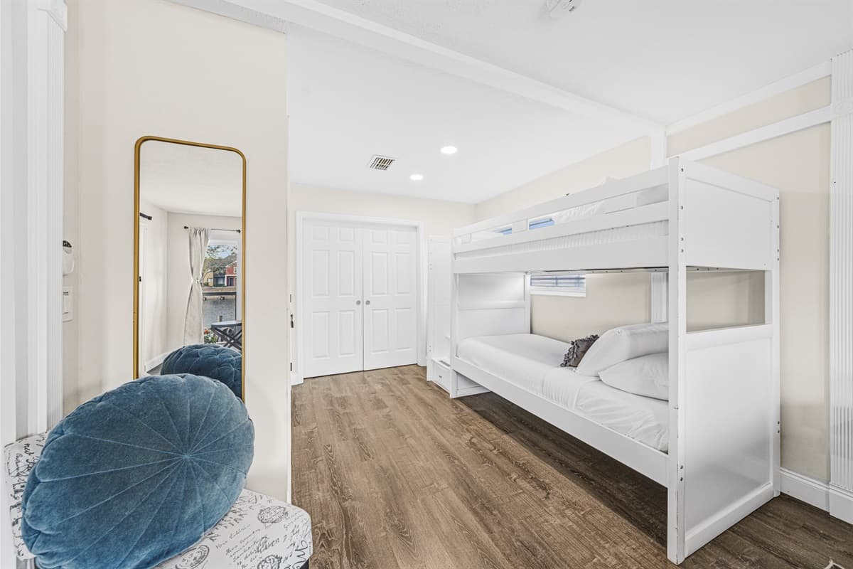 Spacious sleeping area with bunk beds, modern furnishings, and plenty of room to unwind.
