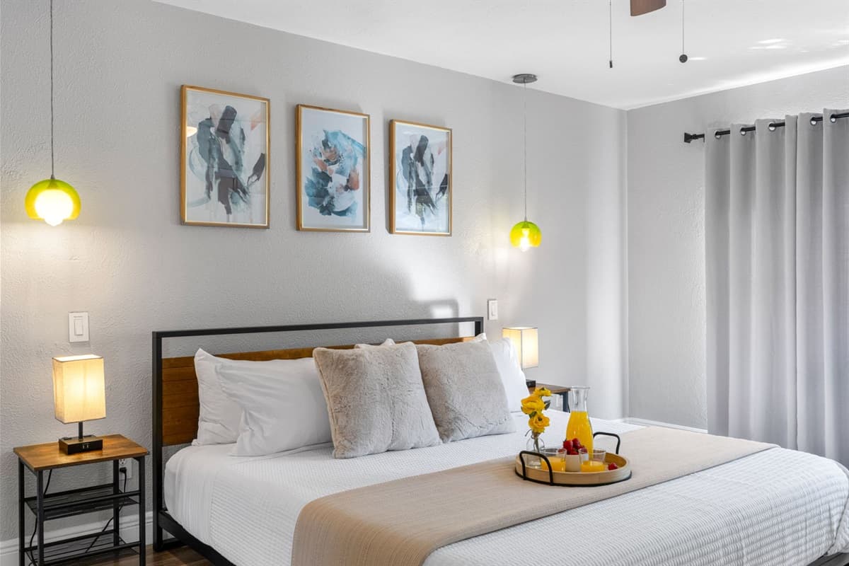 High-quality finishes, neutral tones, and open space make this suite feel fresh and inviting.