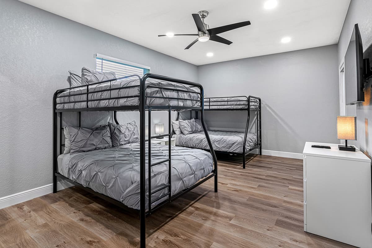 Great for family with kids or an inseparable group of friends. This incredible bedroom has two single over double bunkbeds, full length mirror closet, drawers and a smart TV. Book it now!