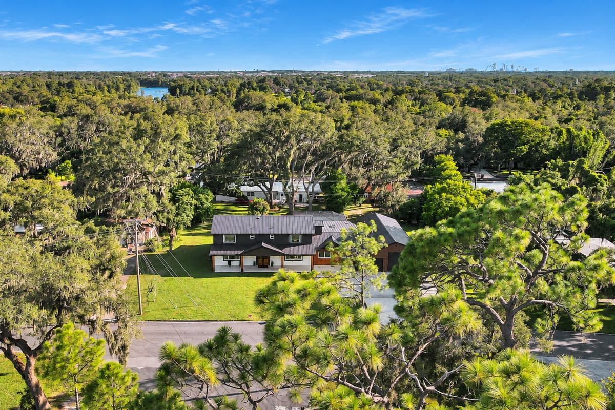Tucked into the oaks, ten minutes from Busch Gardens. A quiet Temple Terrace street with mature trees, deep lots and USF, Tampa and the theme parks all a short drive away.