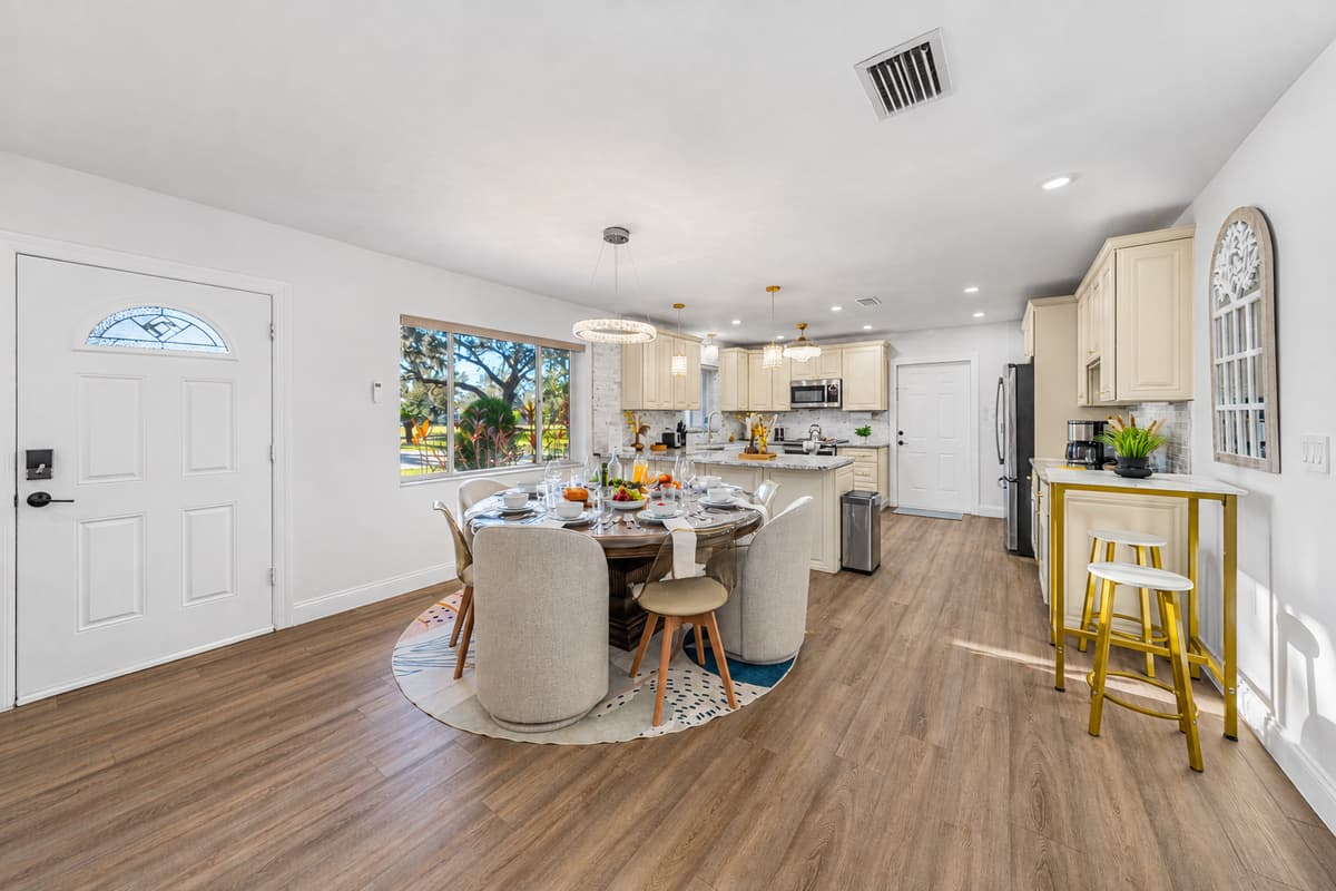 With its elegant lighting and comfortable seating, the dining area is perfect for entertaining or family meals.