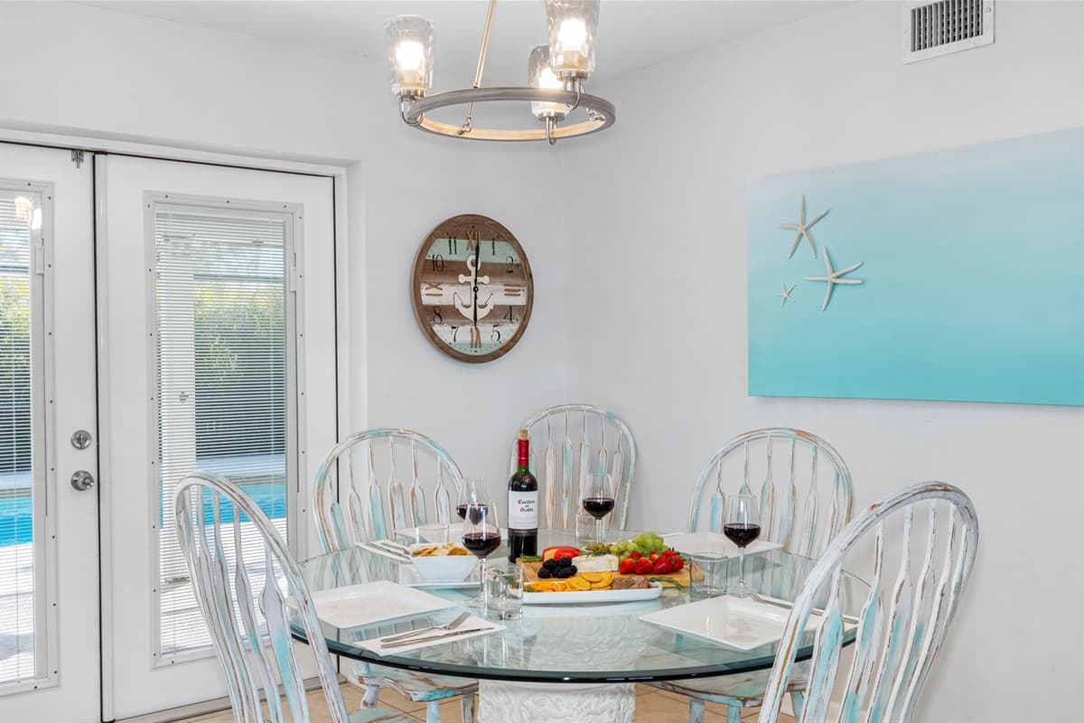 The main dining area features a beautifully crafted six-seater round dining table, perfect for gathering with family and friends.