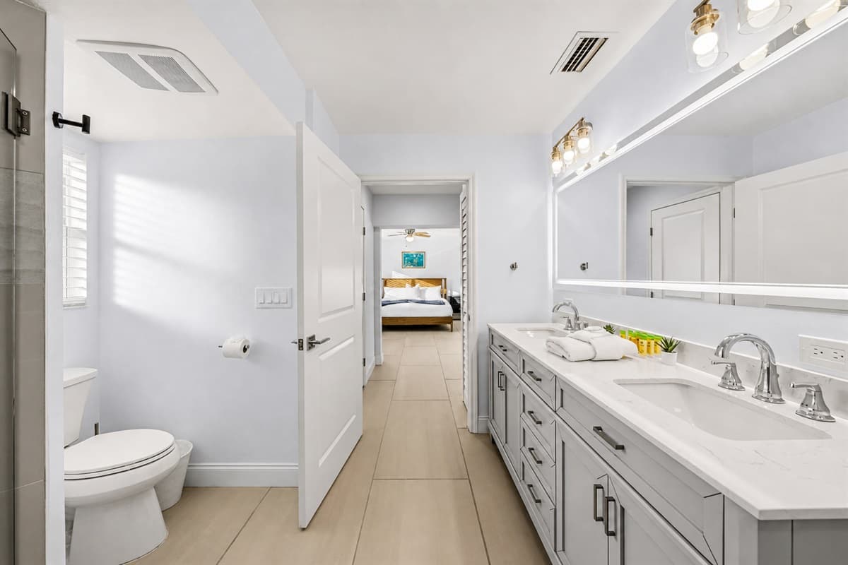 Clean and elegant bathroom with extended countertop space and contemporary finishes.