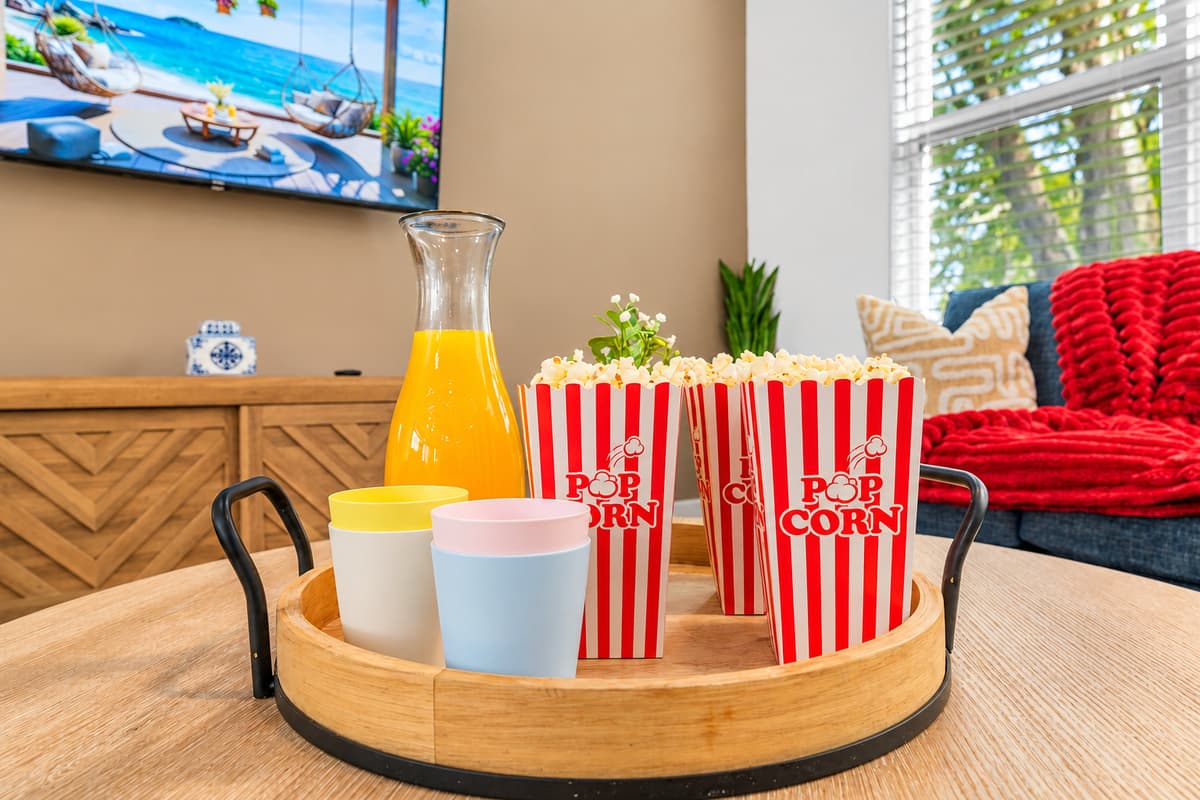 Bring the popcorn. We set the rest. Deep sofas, soft red throws, and a Smart TV ready to stream. With Smart TVs in every room, everyone gets their own show, or the whole group piles on the sofas for one big movie night.