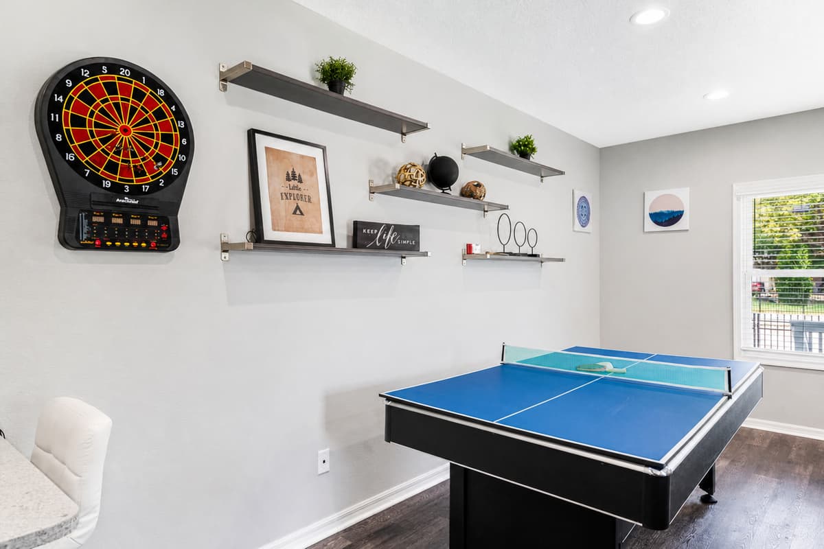 Ample lighting fixtures, strategically placed throughout the area, ensure optimal visibility for gaming and socializing, even during intense matches that stretch into the evening hours.
