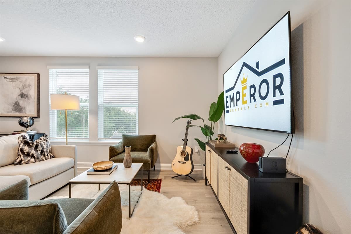 A large Smart TV mounted on the wall, ready to entertain with your favorite shows, movies, and streaming content.