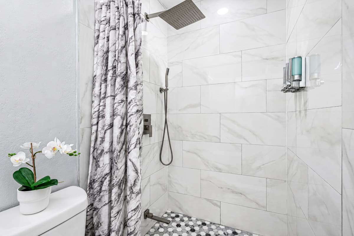 Great bathroom with toilet, sink, and walk-in shower. Feel fresh and clean after a long day of travel from your home to your home away from home. If you are interested in this property, send us an inquiry now!