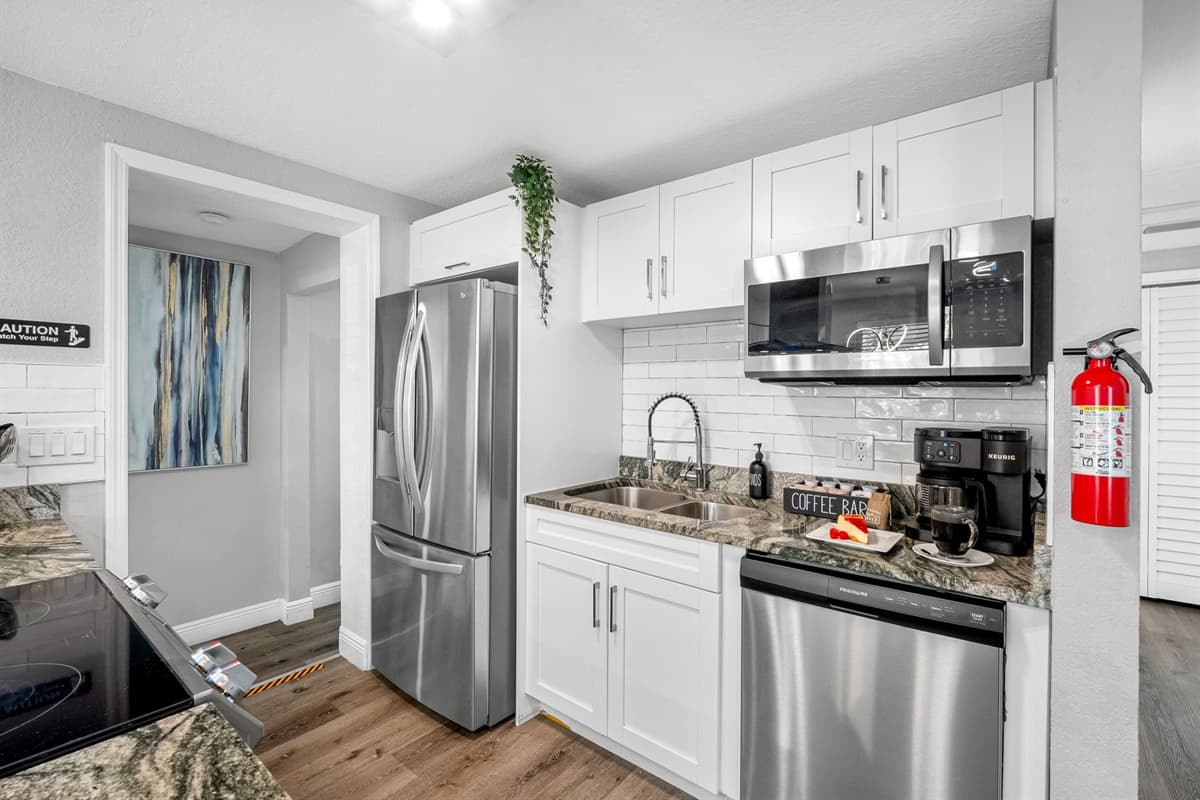 Enjoy a beautifully designed kitchen with modern finishes, pendant lighting, and a spacious island ideal for family gatherings.
