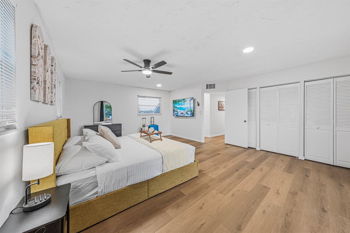 Spacious bedroom featuring a king bed, large closet space, and open layout for added comfort 