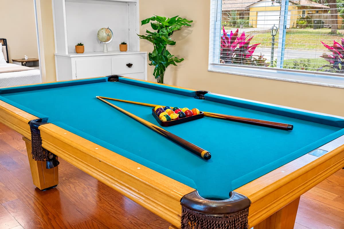 Keep the fun going with this well-lit pool table area just steps from the living room.