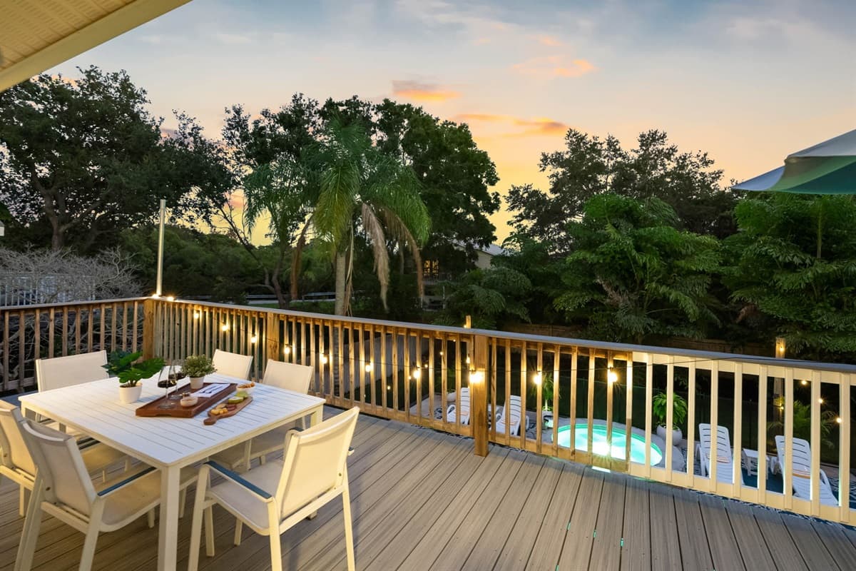 As the sun sets over the trees, enjoy a glass of wine and delicious bites at this serene outdoor dining area. The perfect spot to end a perfect day.