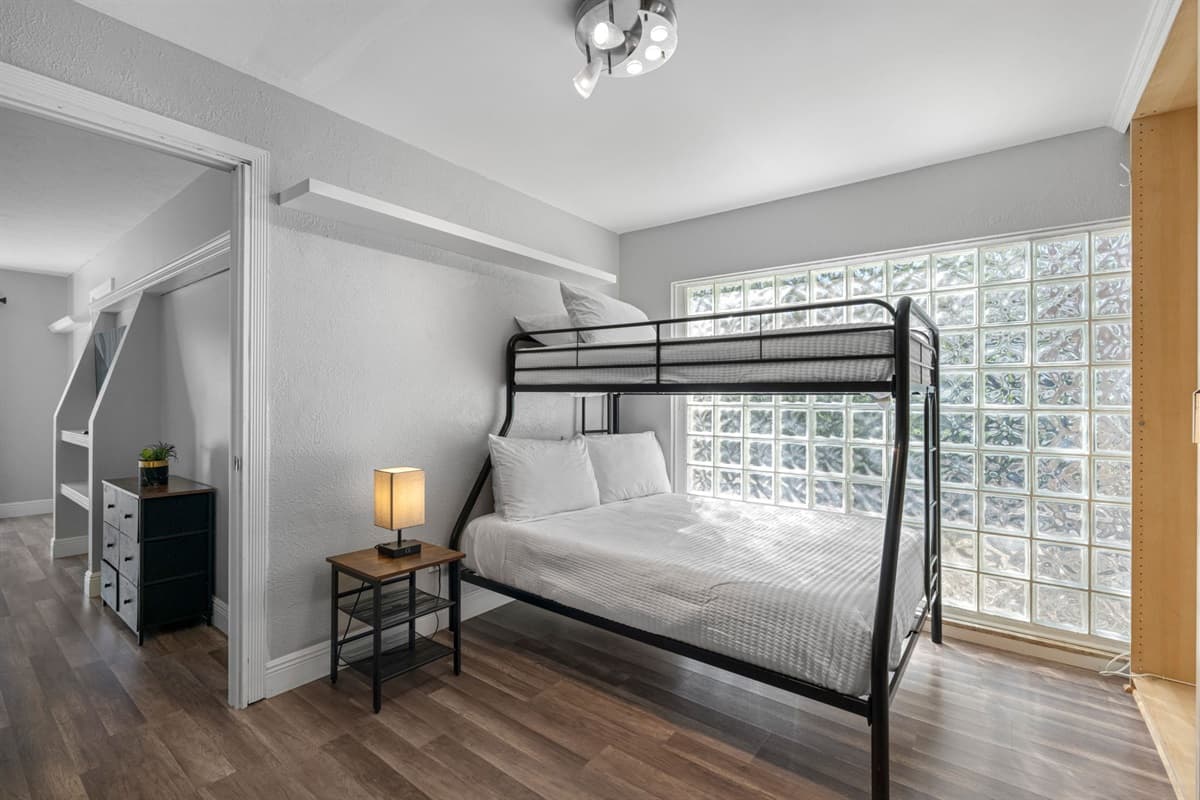A king bed and nearby bunk setup offer flexibility and comfort for families or groups.