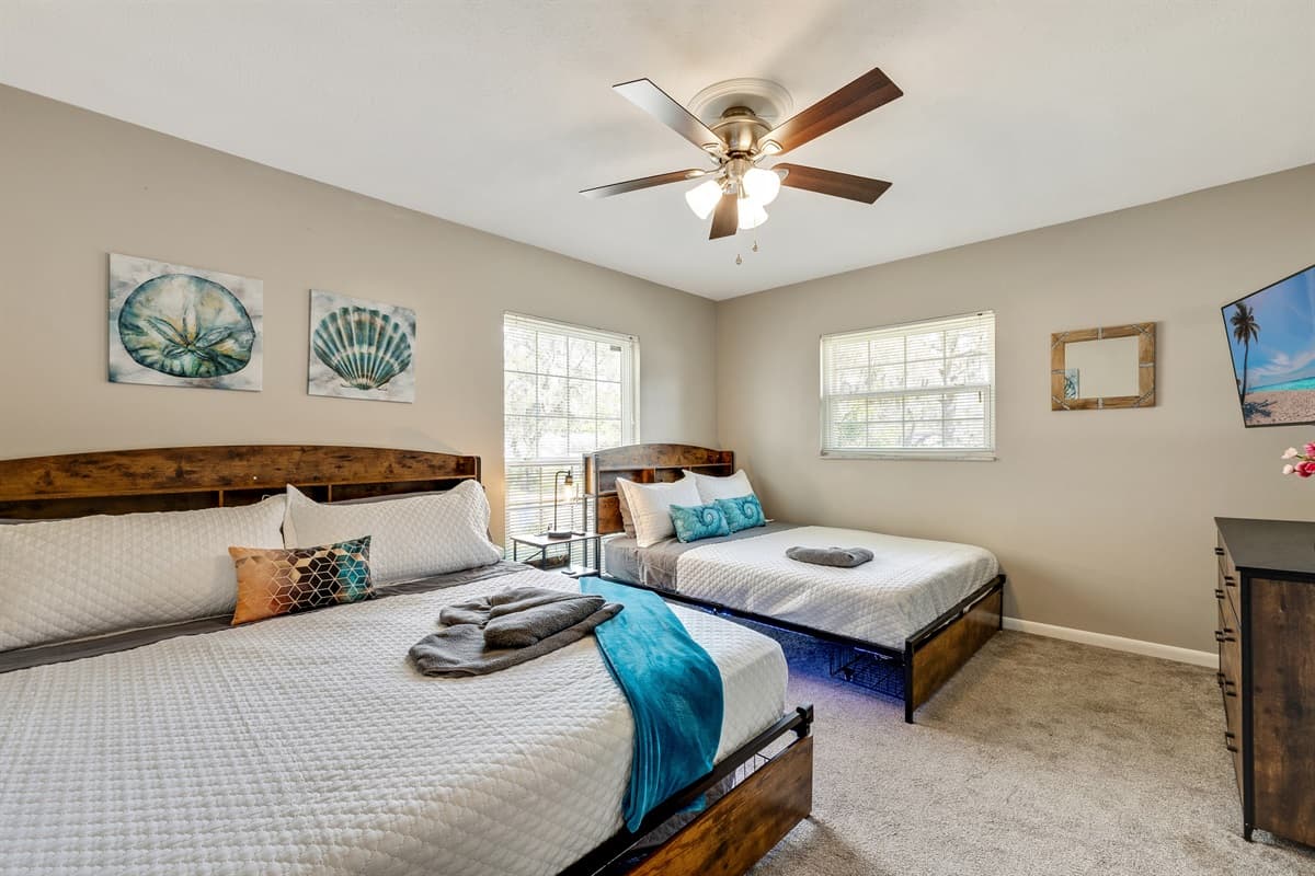 This bedroom beckons you to sink into its plush embrace and surrender to a night of unparalleled relaxation.