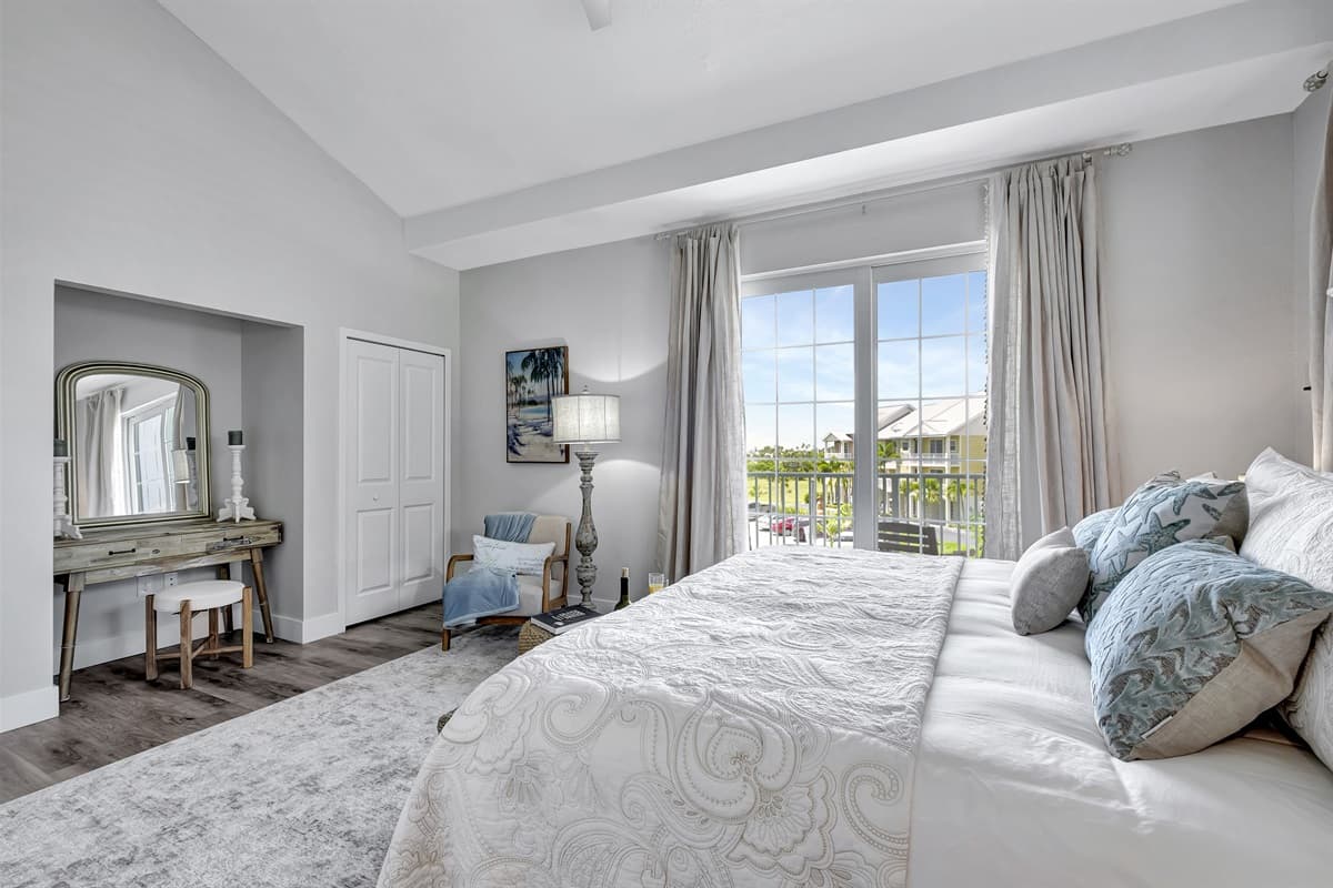 Adorned with oversized windows, this bedroom is a symphony of light and air.