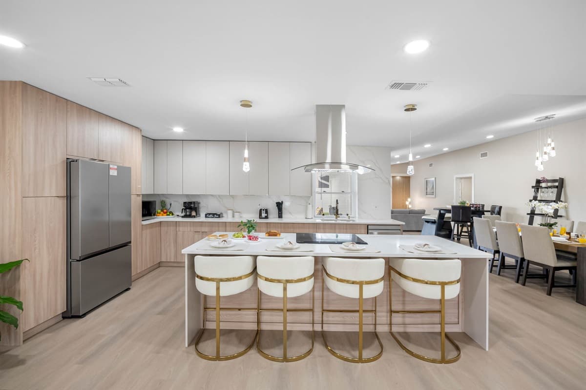 Perfect for entertaining or relaxing over a meal, this kitchen exudes timeless sophistication.