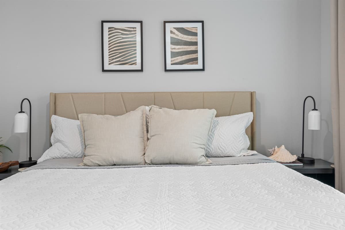 Soft pillows beckon, offering support and solace as you drift off into a restful slumber.