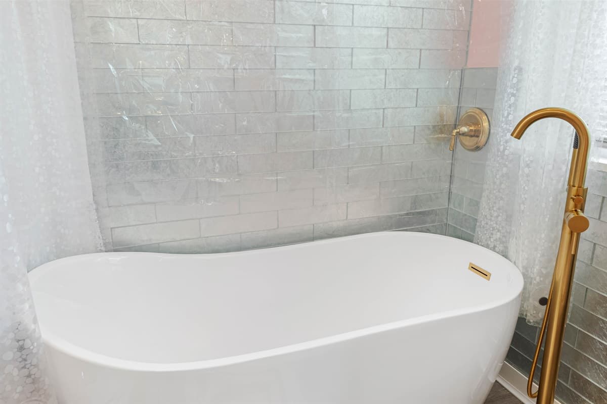 The bathroom includes all the essentials, including a bathtub, perfect for a soothing soak after a day of outdoor adventures.