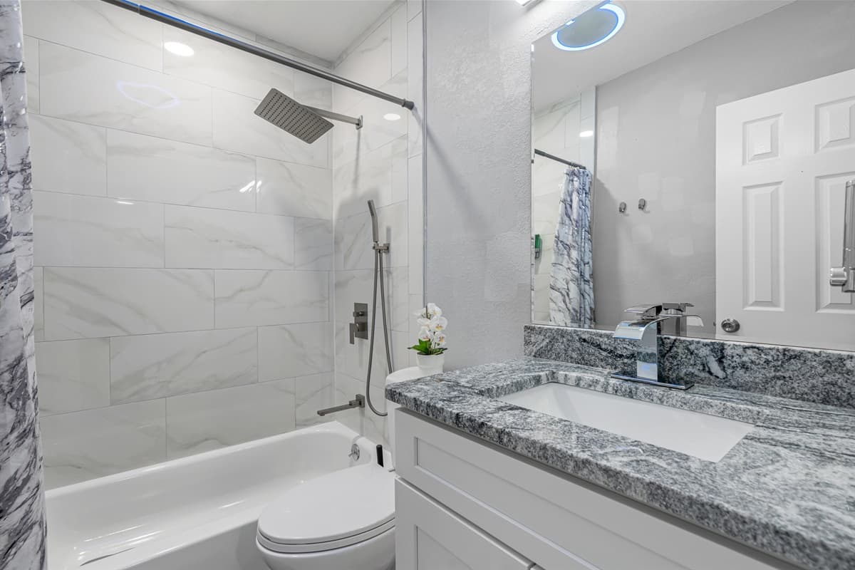 Beautiful bathroom equipped with bathtub, sink, toilet and shower. Enjoy a relaxing bath after a long day of travel from your home to your home away from home. If you think this property if for you, send us an inquiry right away!