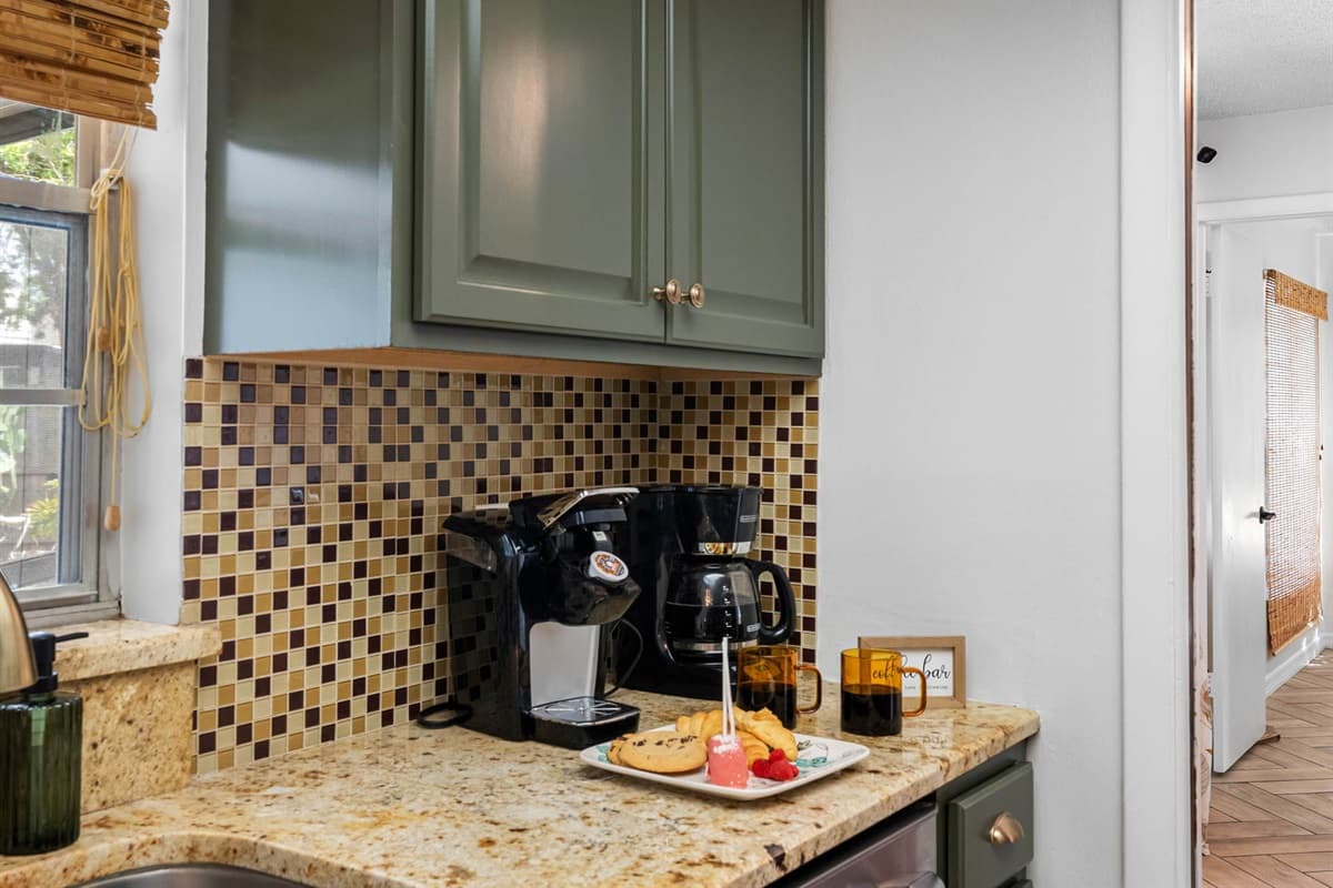 Located just off the dining area, the kitchen makes mealtime a breeze. Enjoy easy access to all your cooking tools, plus spacious countertops and a clean, modern design you’ll love spending time in.