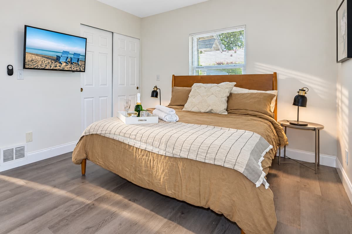 Who wouldn't love this elegant room with queen sized bed, spacious closet, vanity, and its own smart TV! If you like what you see, send us a message now!