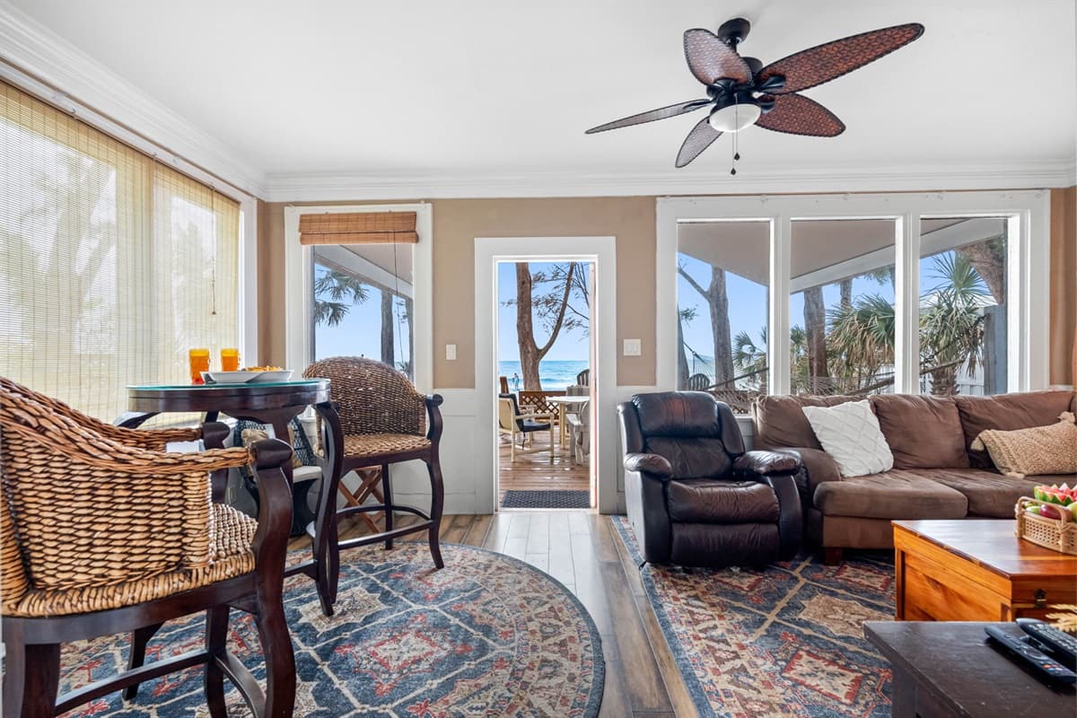 Large windows allow natural light to flood the room during the day, creating a bright and airy feel, while curtains or blinds offer the option to darken the space for a more intimate setting.
