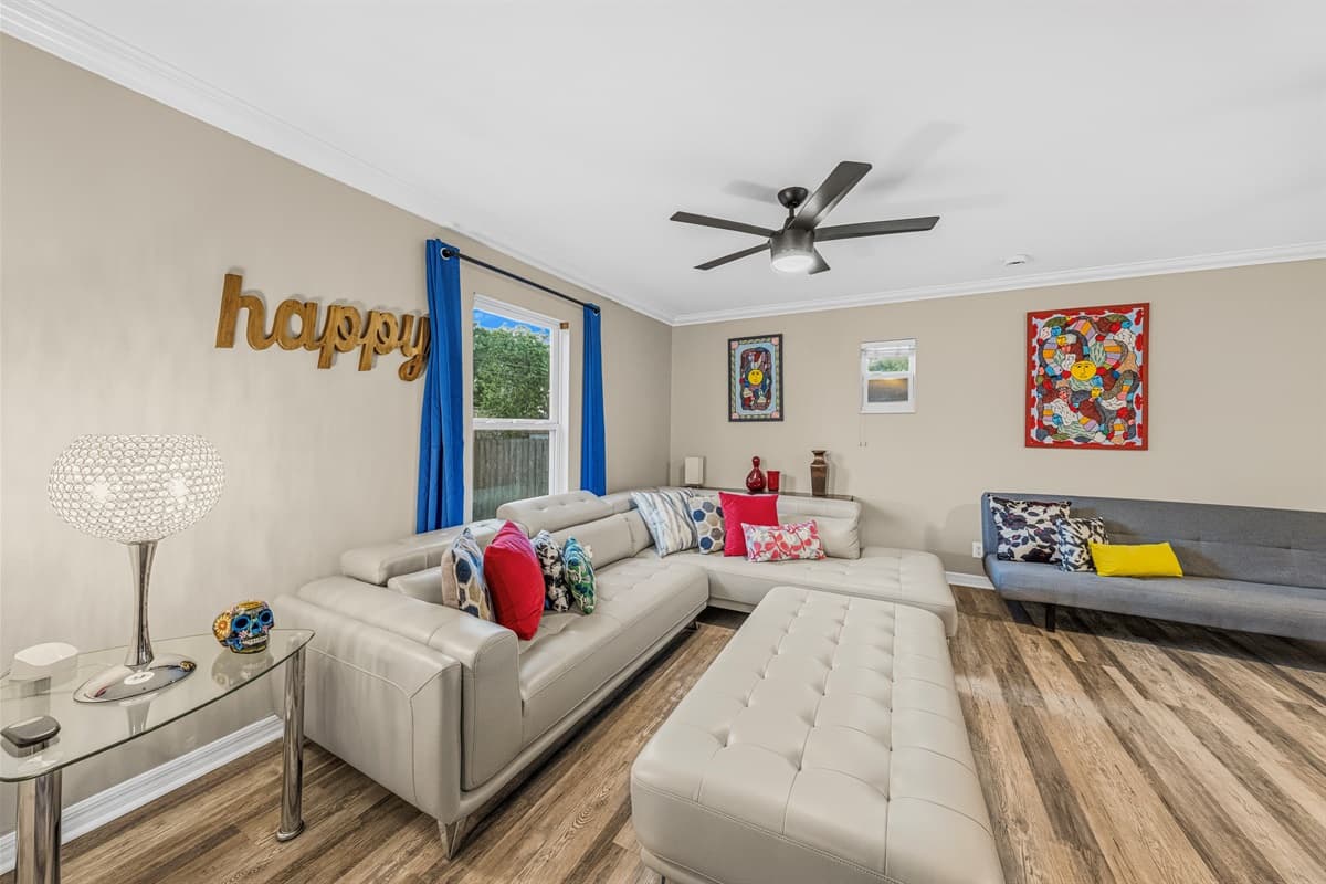 Bright and inviting living room with plush sectional seating, stylish décor, and plenty of space to relax.