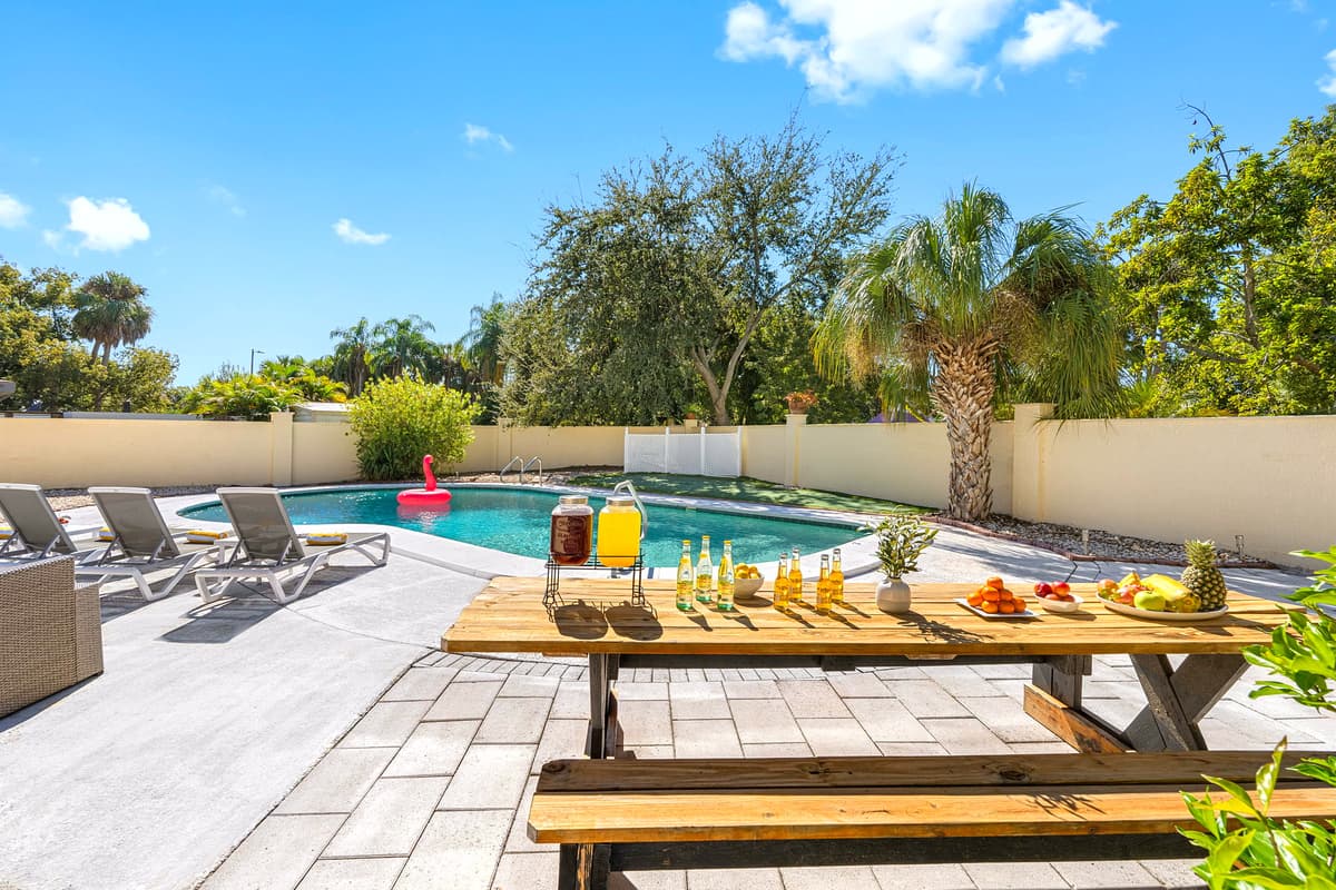 Step into your own private paradise! The shimmering pool, palm trees, and modern patio furniture make this space perfect for relaxation or entertaining.