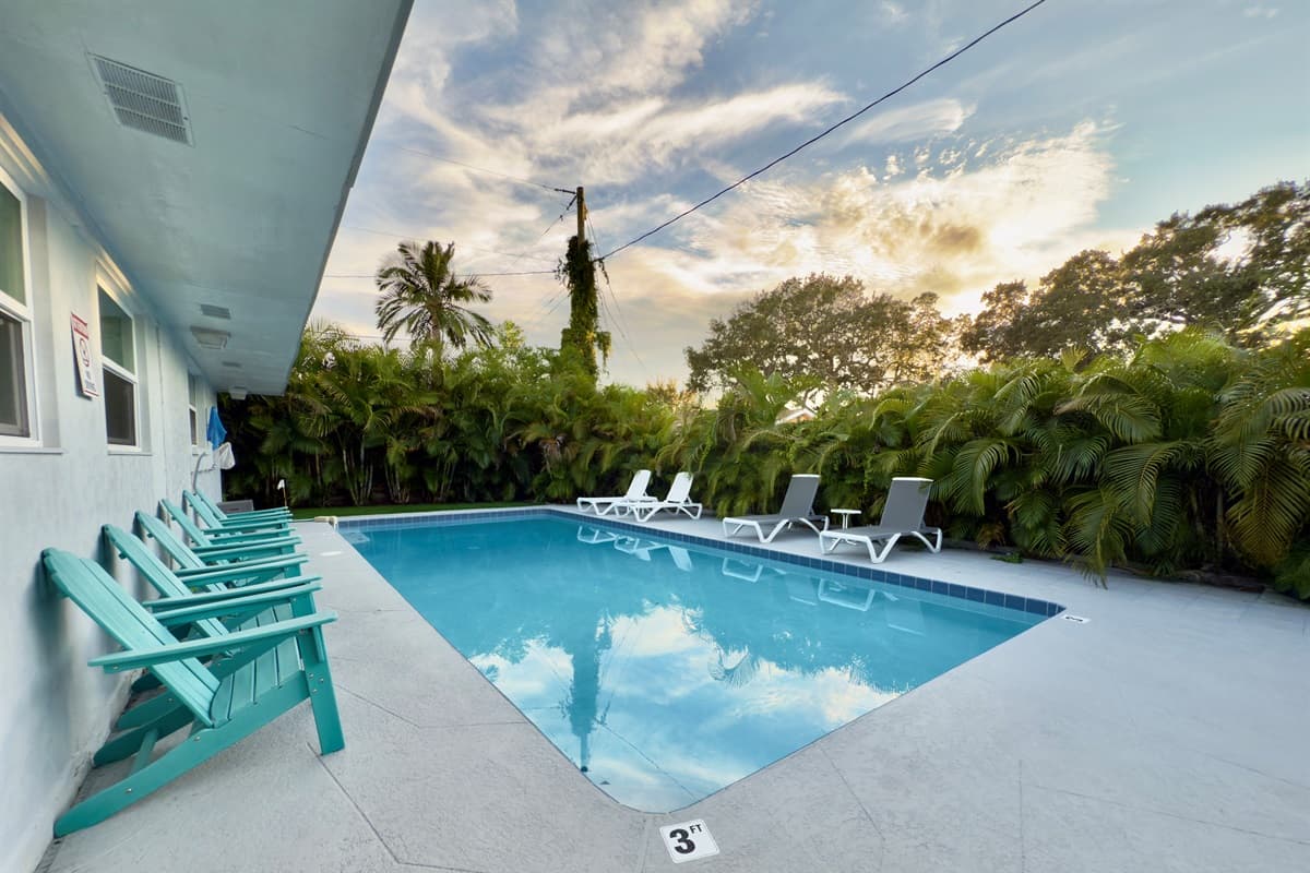 Picture yourself enjoying a poolside cocktail surrounded by lush greenery and endless sky views.