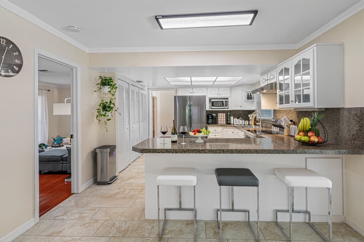 Crisp, clean lines and modern finishes make this kitchen a true showstopper, while still maintaining a warm and welcoming vibe.