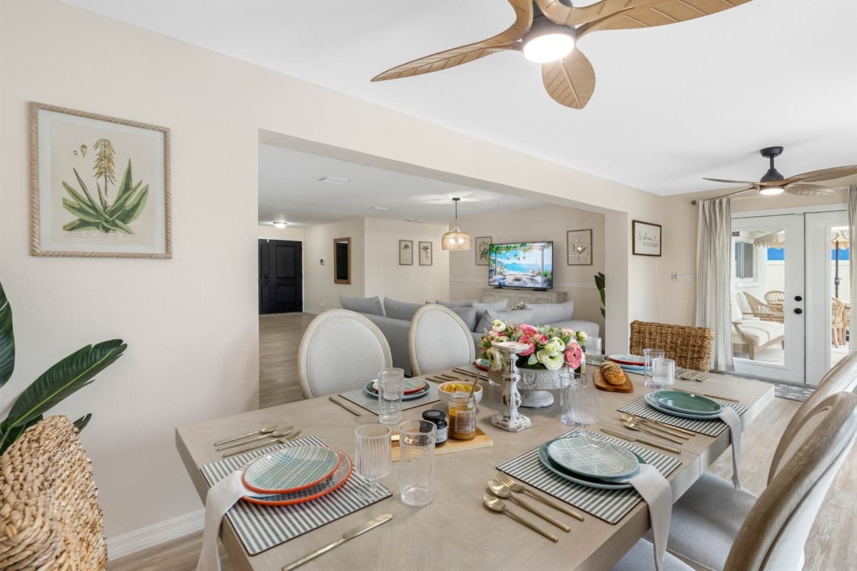 This dining area flows seamlessly into the kitchen and living space, making it ideal for hosting dinners, game nights, and special celebrations.