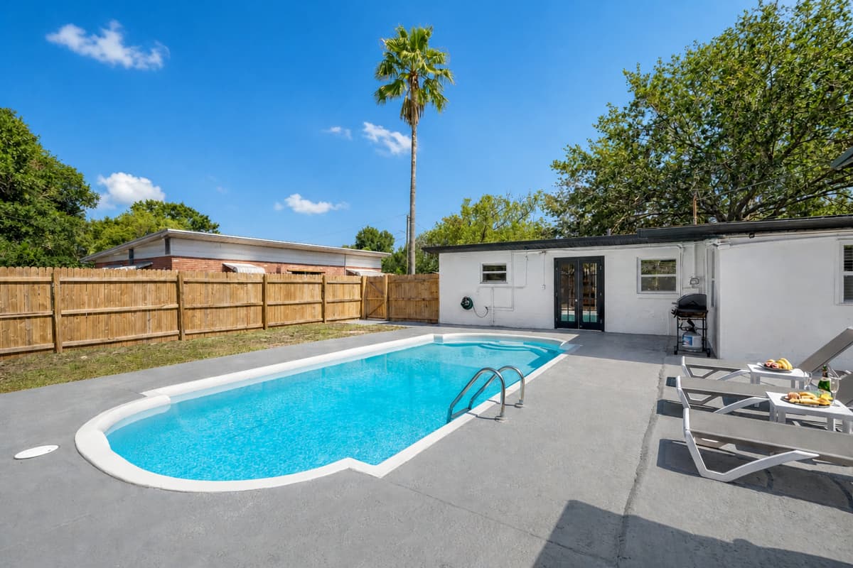 The sparkling waters of the pool beckon you to take a refreshing dip and soak up the sun.