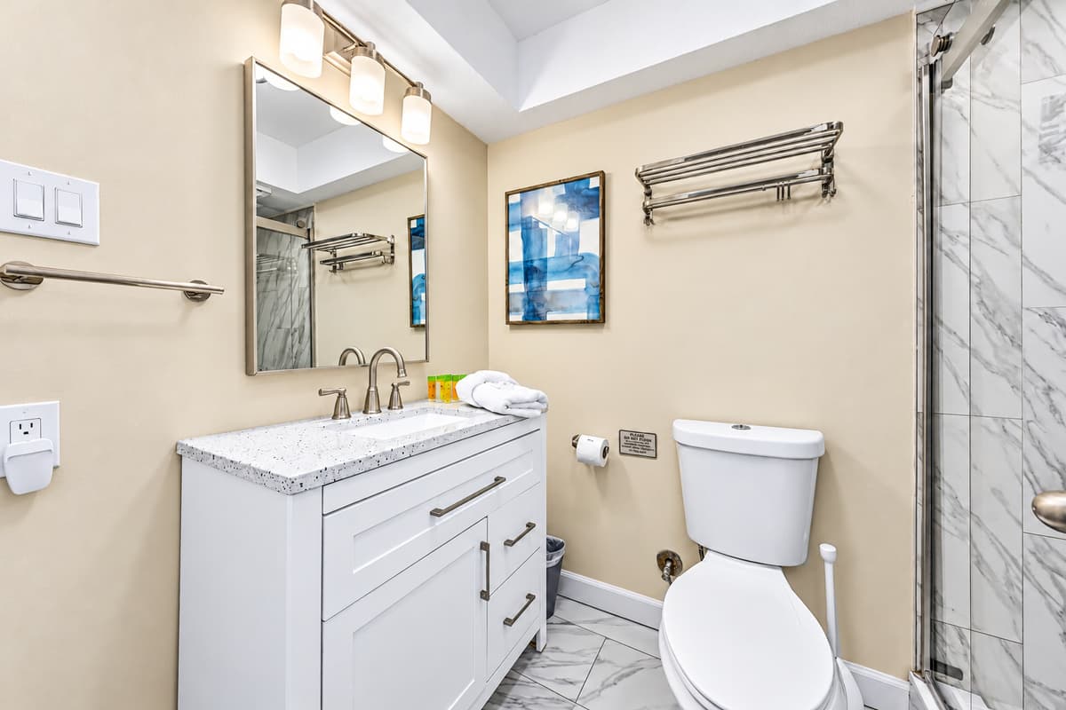 Fresh and stylish full bathroom stocked with essentials for your stay.