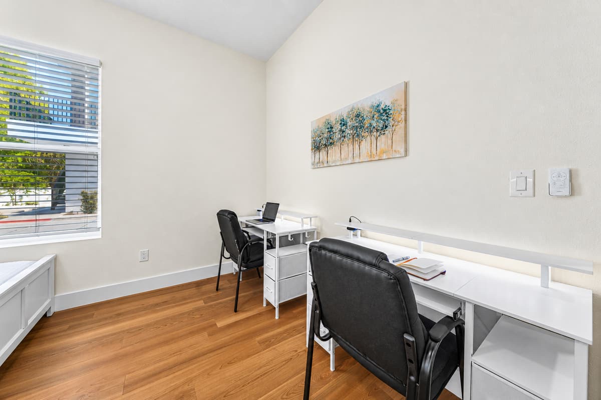 Bedroom with workspace and natural light—perfect for longer stays.
