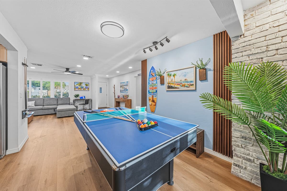 Open entertainment space connecting the game area to the main living room—perfect for socializing 